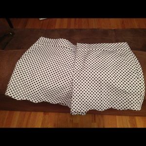 White club Monaco shorts with navy dot detail.